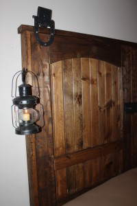 The doors with lanterns and reclaimed barn track pulleys attached