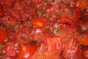 Fresh from the garden - a large stockpot cooks down tomatoes, onion and green peppers for a batch of salsa.