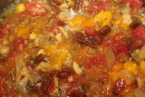 Mix tomatoes and bread with the onion mixture and let simmer