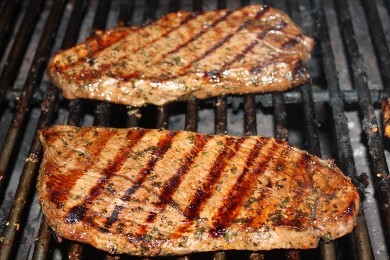 steaks on grill