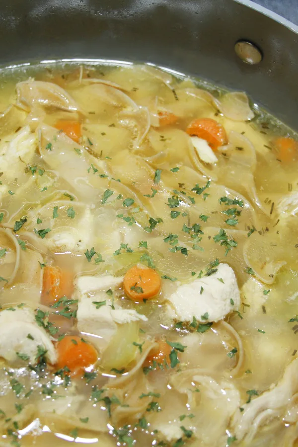 simmering chicken noodle soup