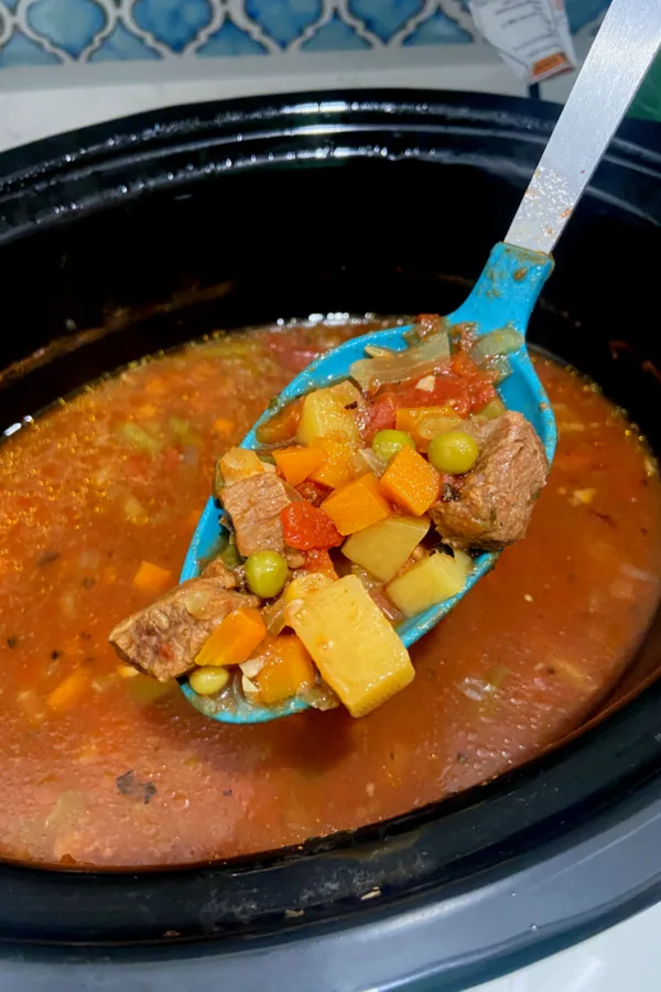 scoop of crock pot vegetable beef soup