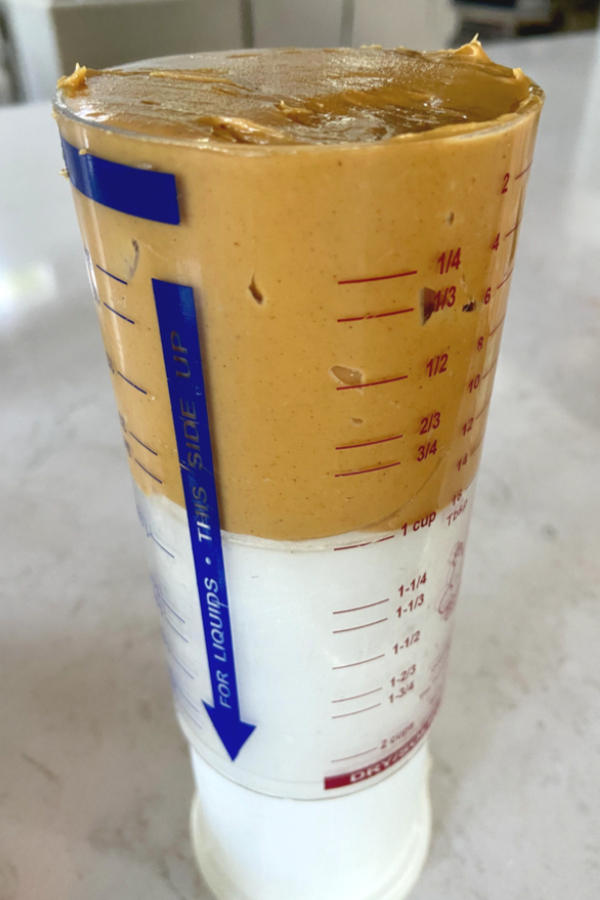 peanut butter in a push measuring cup