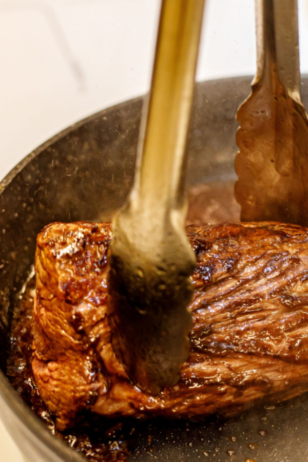 searing meat in skillet 