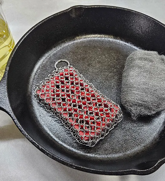 Season and re-season cast iron cookware with the use of oil, a chainmail scrubbie, and steel wool to have a timeless cookware piece