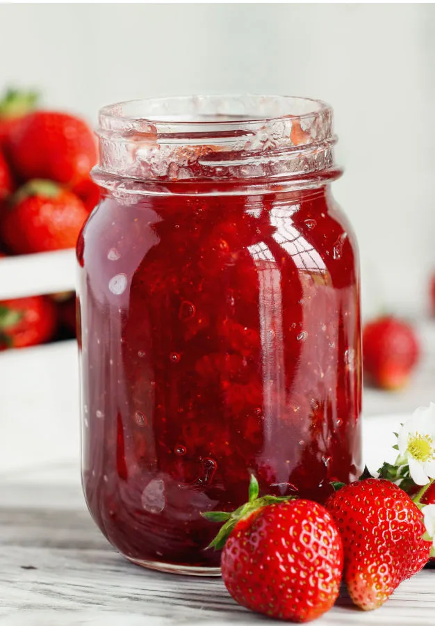 jam filled to the top of  mason jar