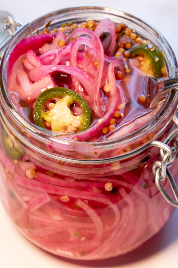 jar of red onions with jalapeno slices 