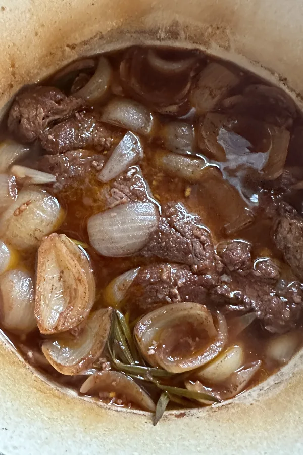 pot roast half cooked with onions