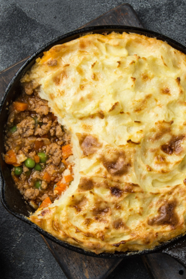 shepherd's pie with a portion of it scooped out